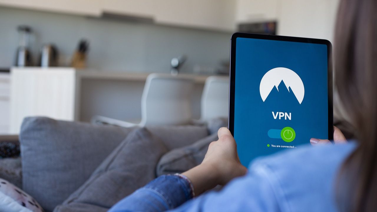 Image of a woman using a VPN on a tablet 