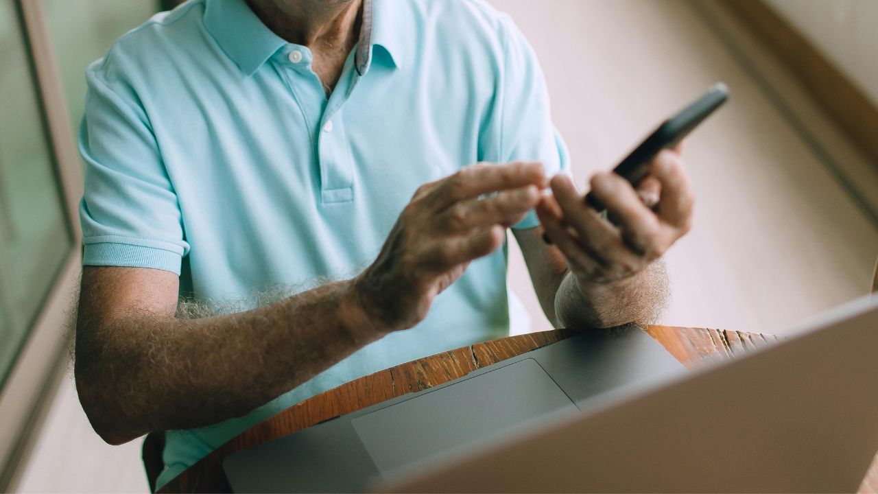 A man using his bank app to budget his finances 