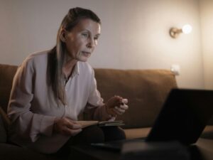 A woman on an old computer with old software