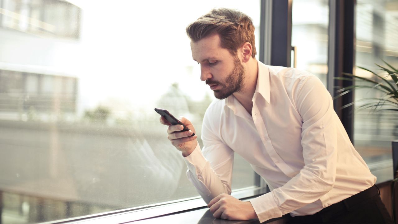 A man texting on his phone 