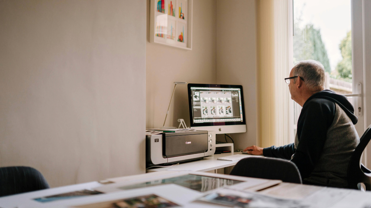 A man printing photos from his iPhone 