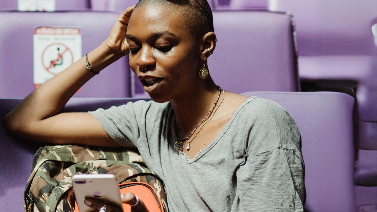 A woman looking at an international call coming in on her phone 