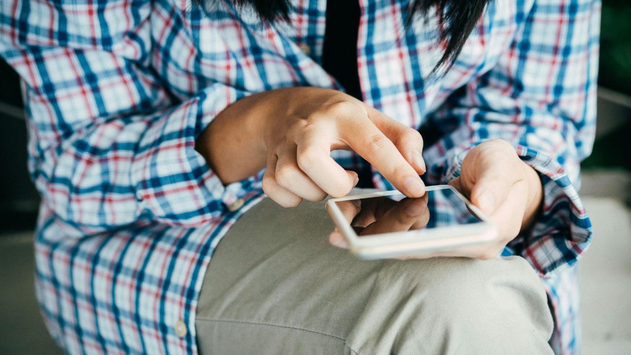 A person texting on their phone