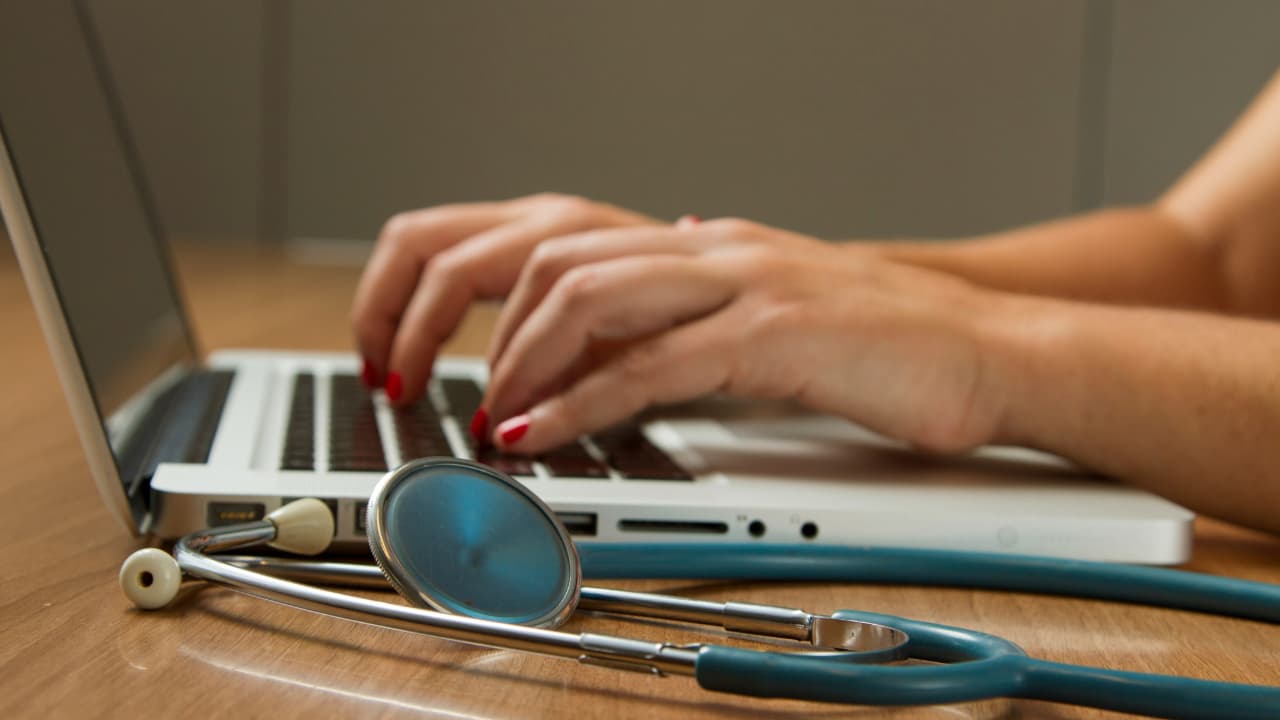 A person typing on a keyboard