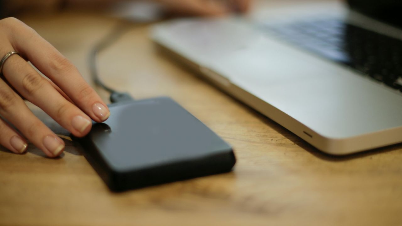 A hard drive plugged into a Mac 