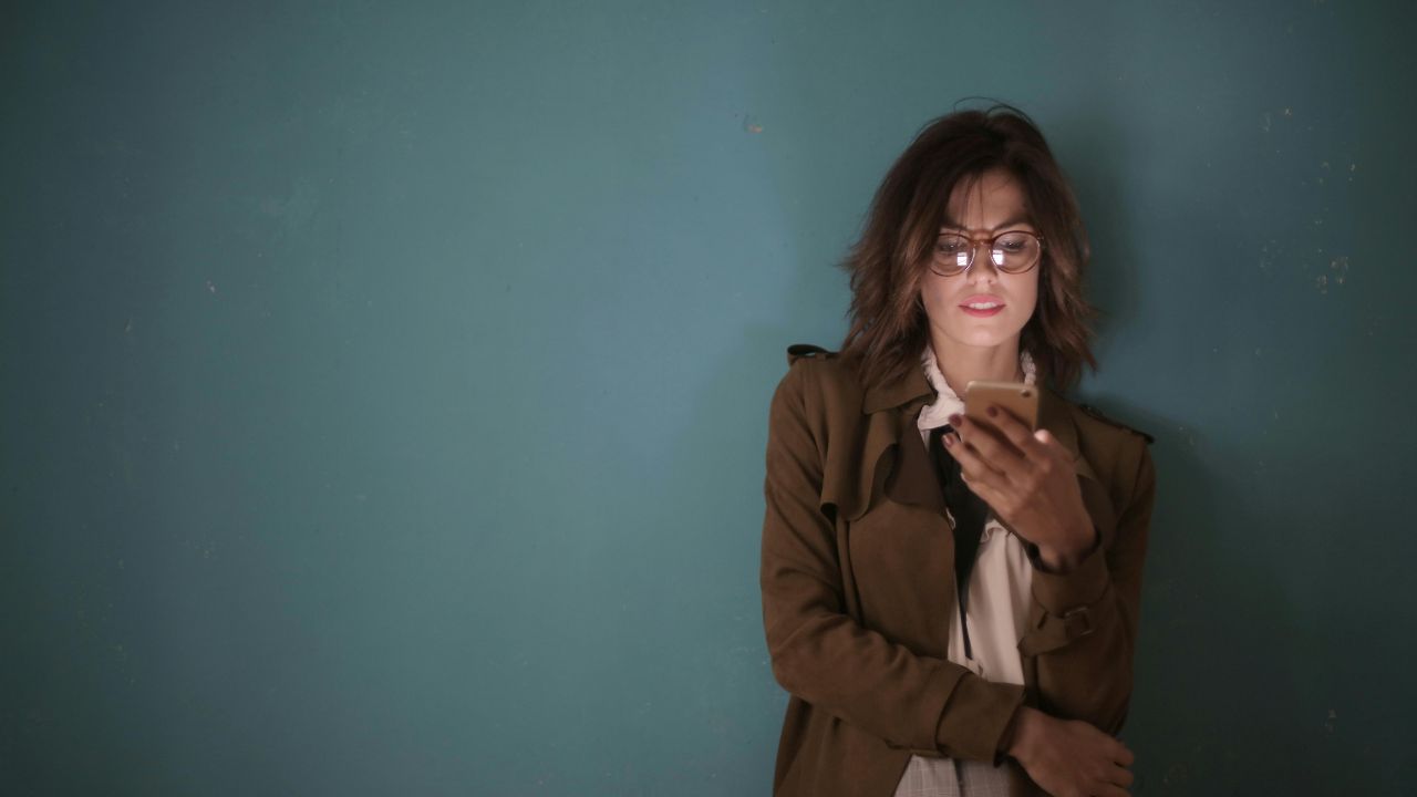 woman looking at iphone