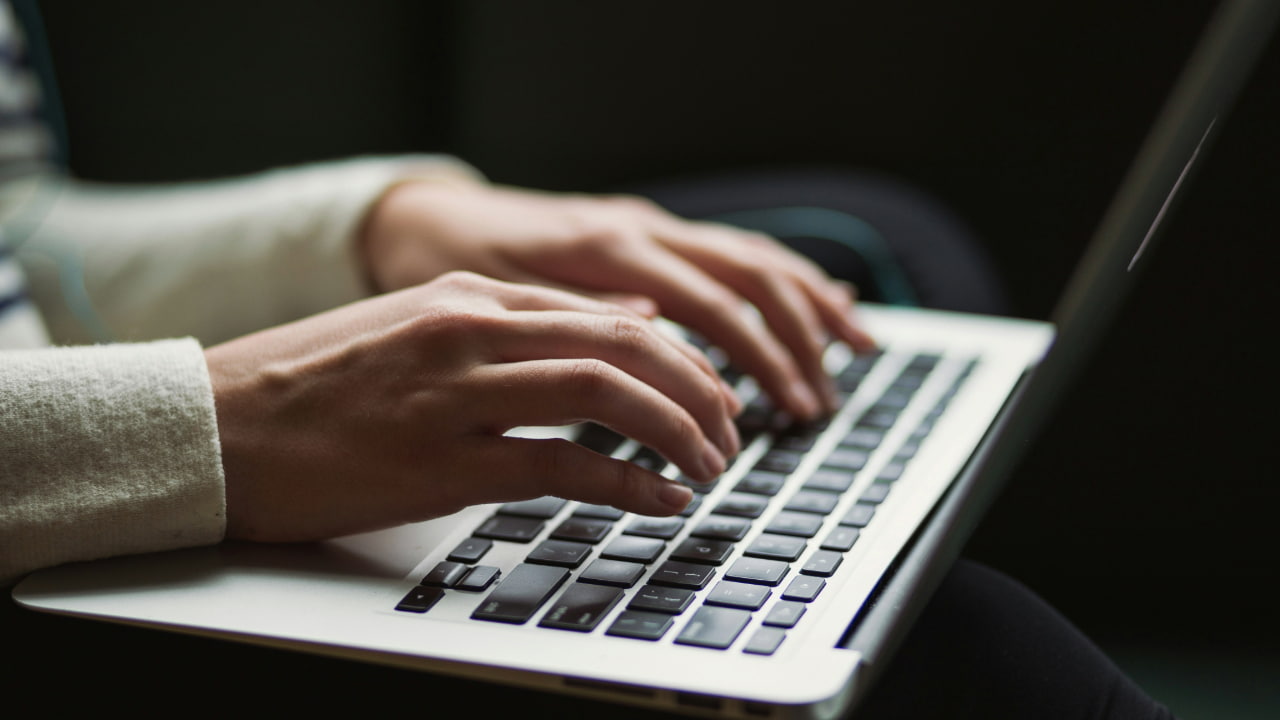A person is using a MacBook
