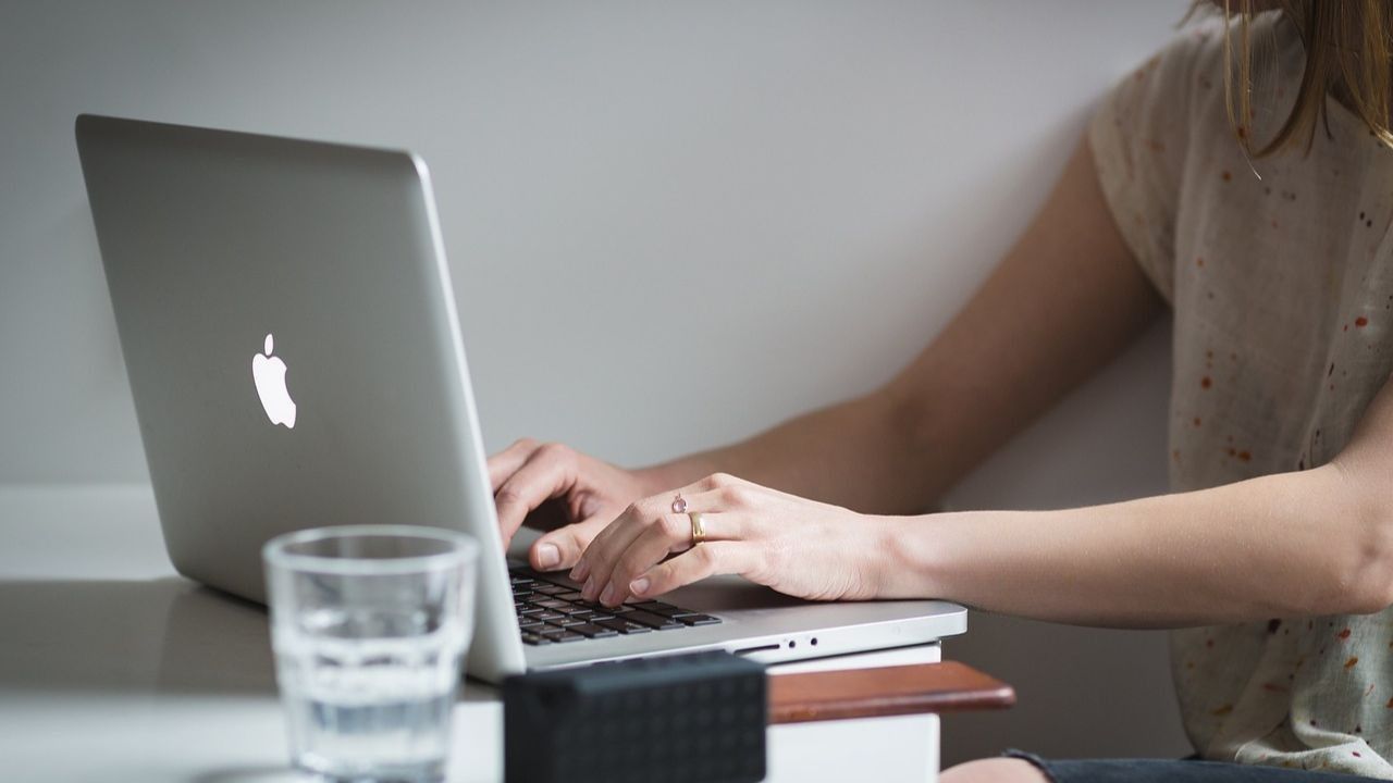 A woman checking her emails on her laptop 