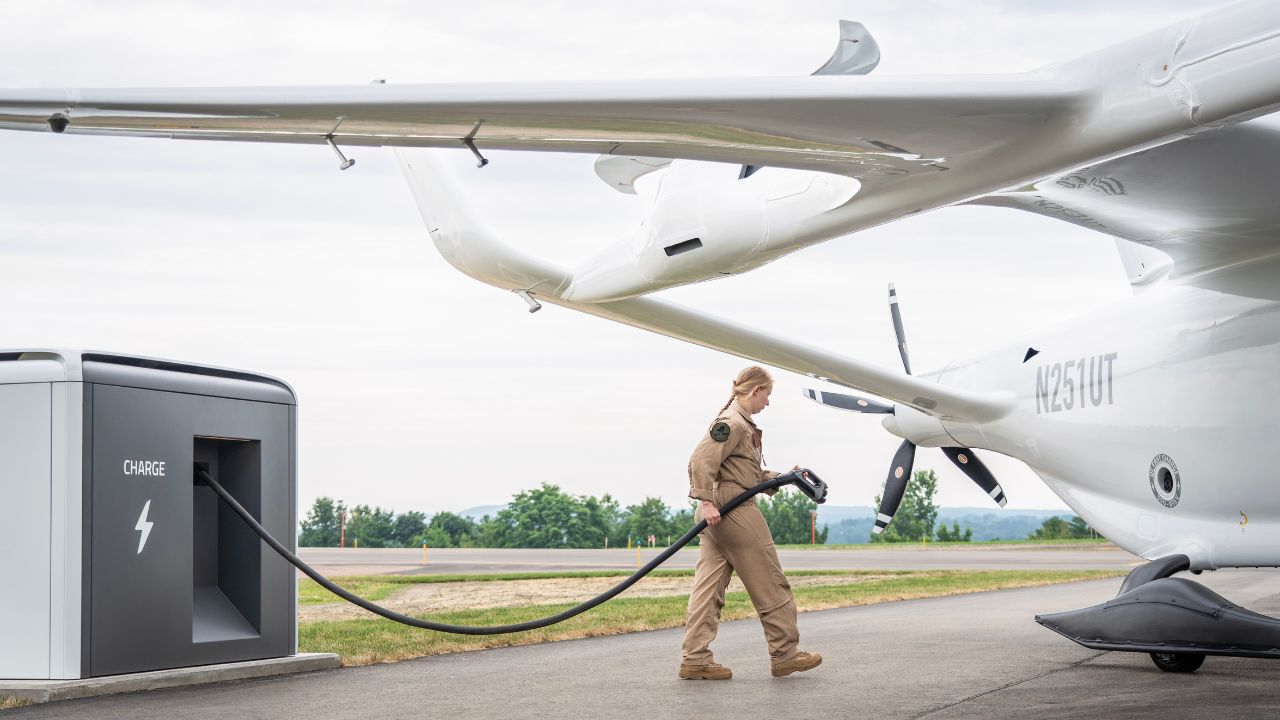 Passenger-carrying electric airplane being charged 