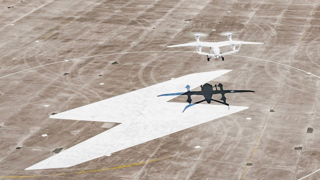 Passenger-carrying electric airplane landing on tarmac 
