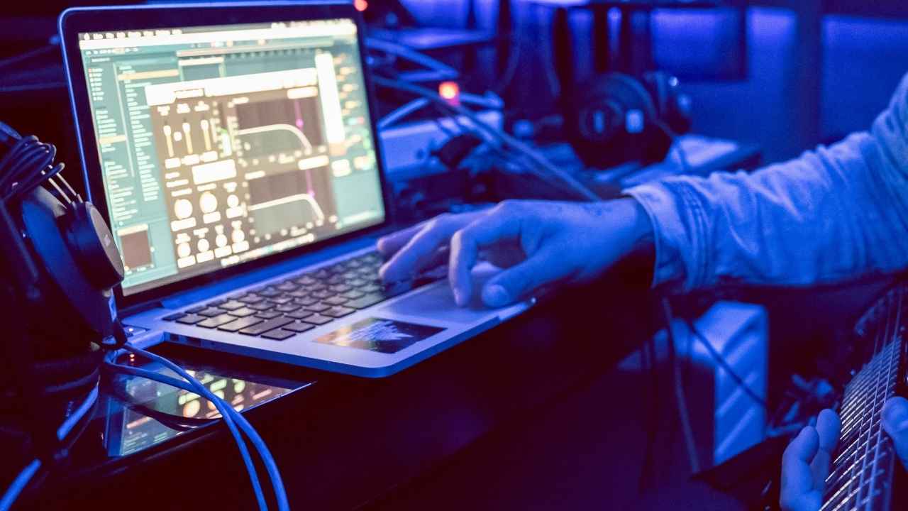 A man creating music on a laptop 