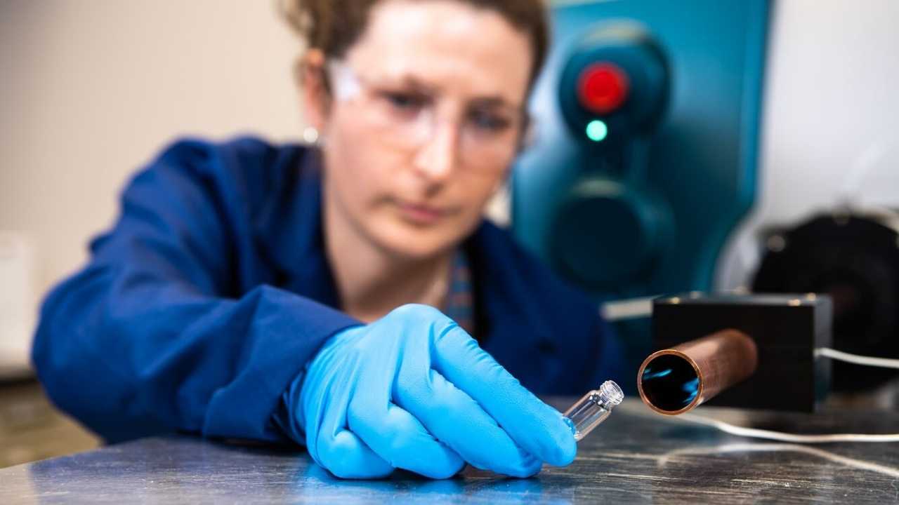 Chemist Elizabeth Denis uses the PNNL system to check a substance in the laboratory