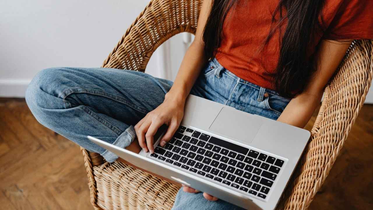 A woman checking her emails on her laptop 