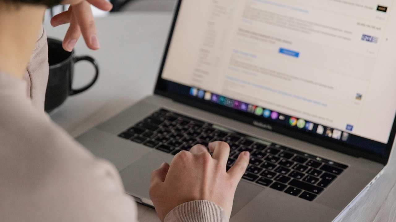 A woman checking her emails on her laptop 