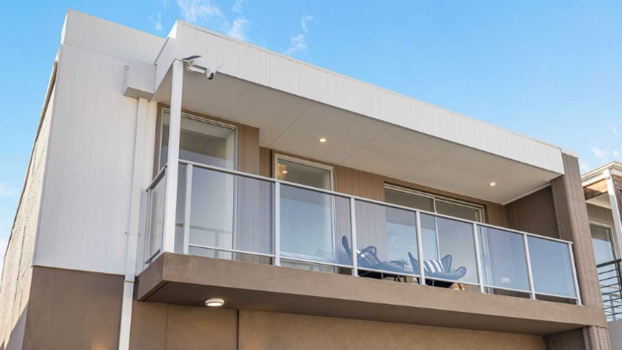 Exterior of a multi-story 3D concrete printed home located in Tapping, Australia. 