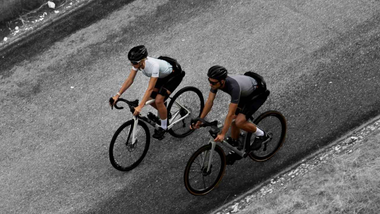 Cyclists wearing the Hypershell X Ultra exoskeleton while on a ride 