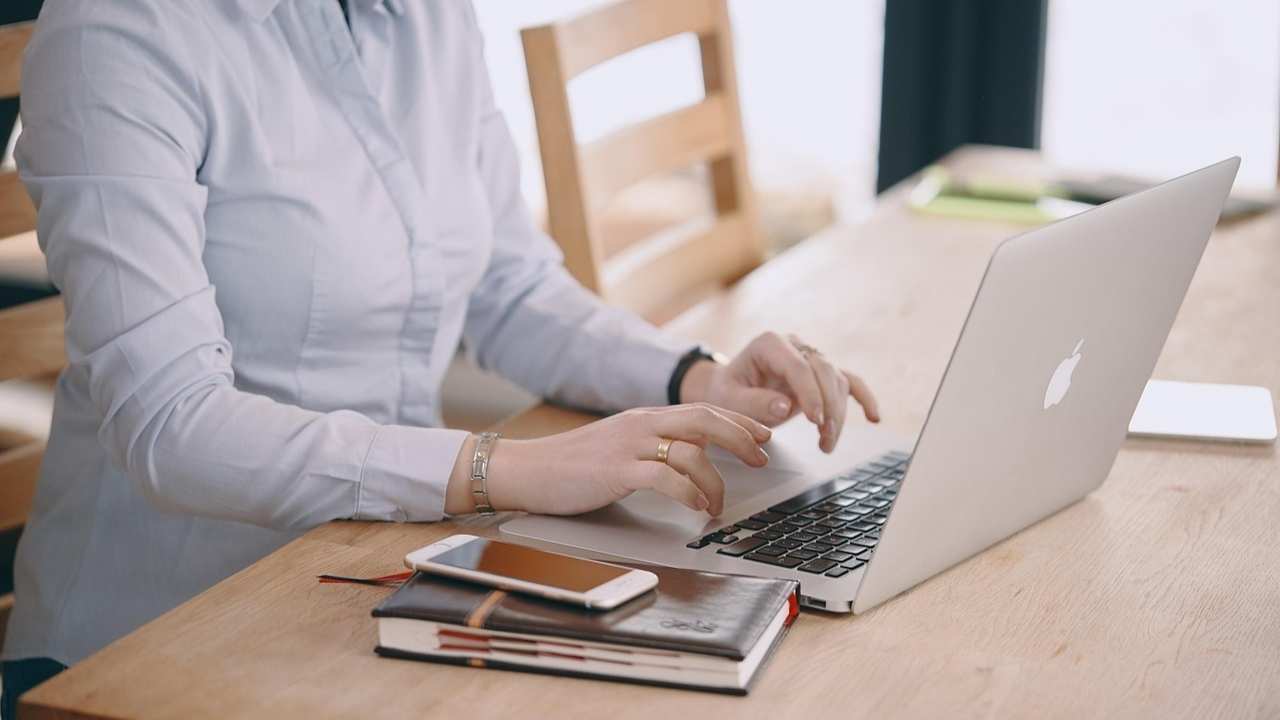 A woman looking at public probate records on her laptop 