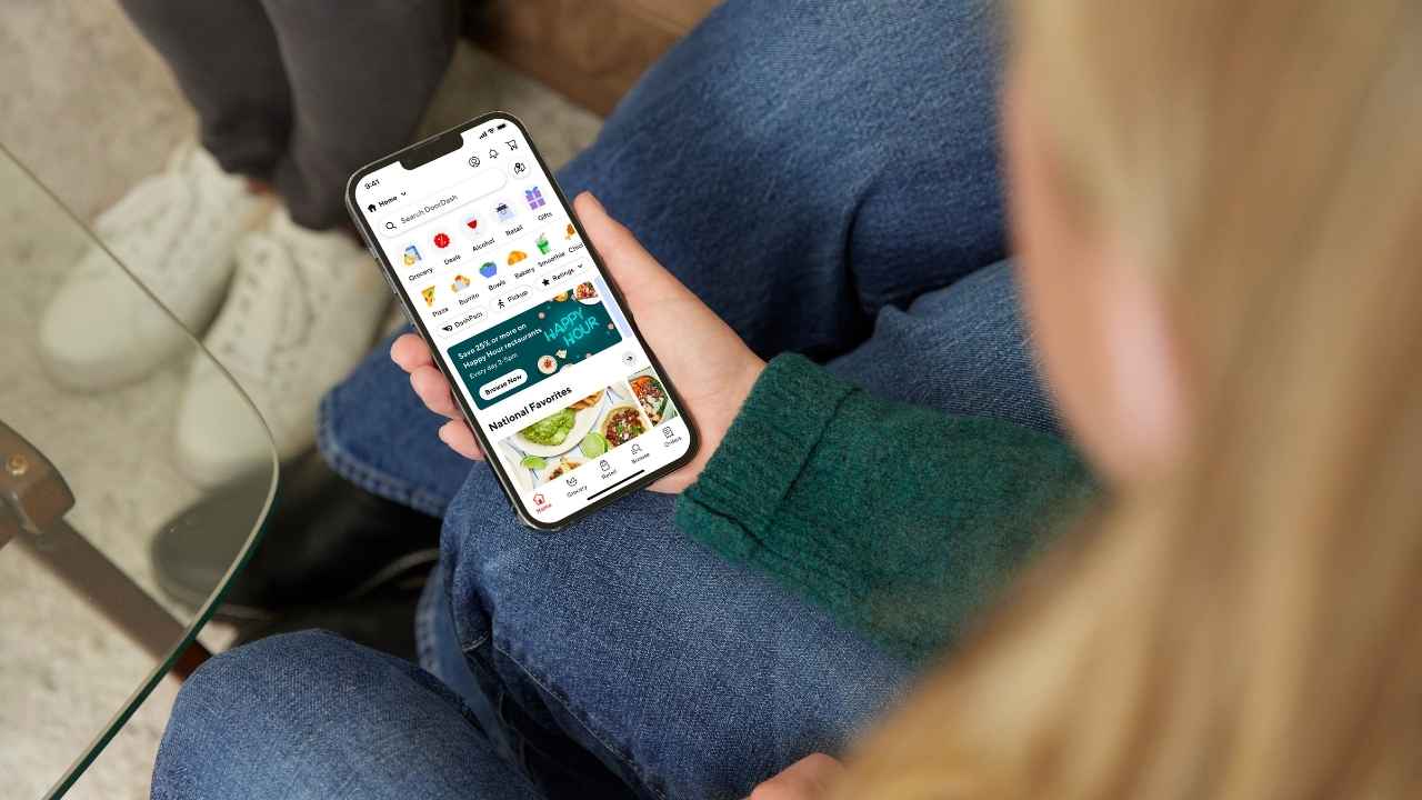 A woman using the DoorDash app 
