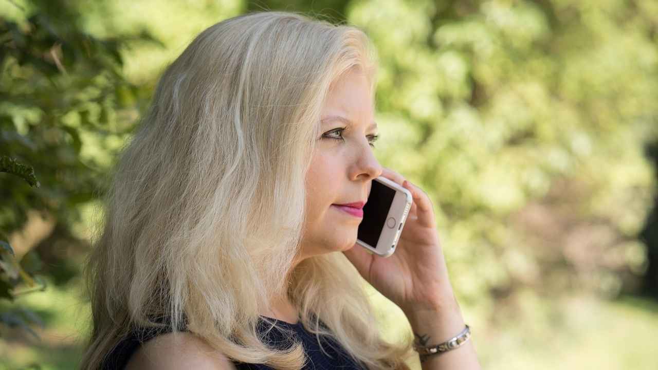 A woman receiving a bank scam call 
