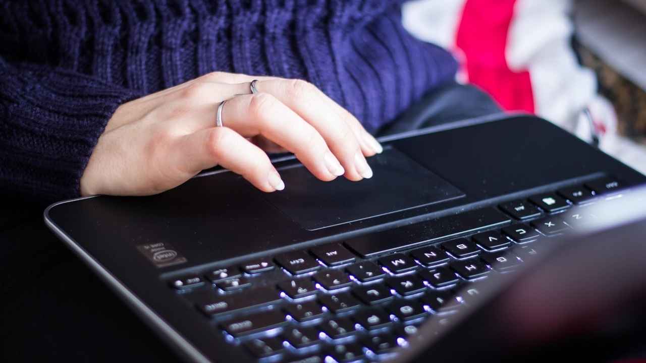 A woman checking her emails on her laptop 