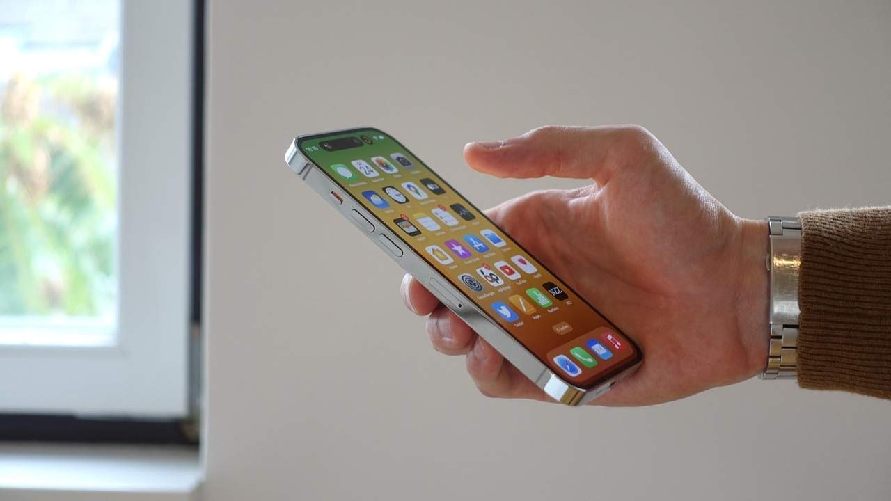 A man using his iPhone 