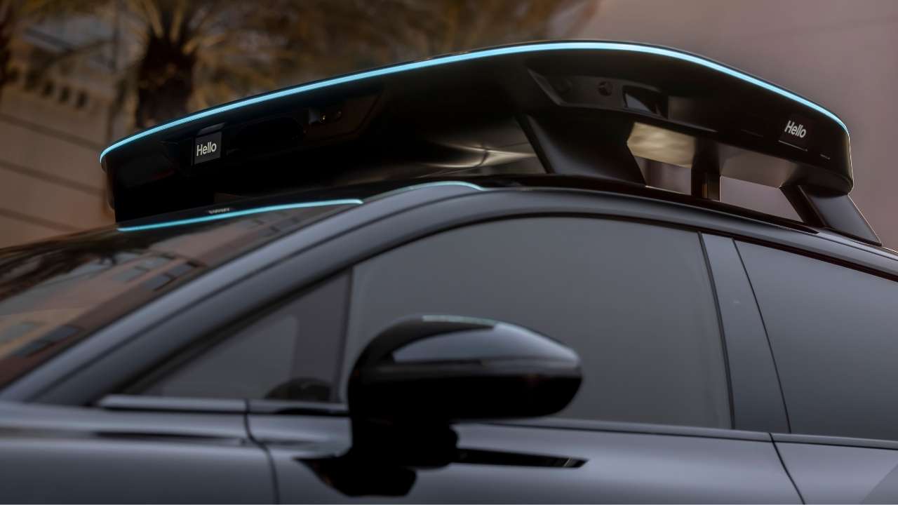 Roof-mounted autonomous sensor halo displaying “Hello” on external LED panels.