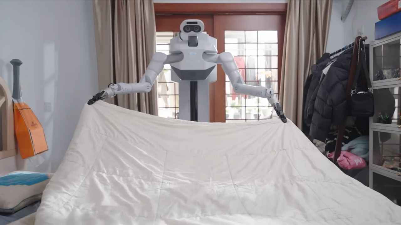 The robot uses its dual multi-jointed arms to handle soft materials like bedding, a task that remains challenging for most home robots.
