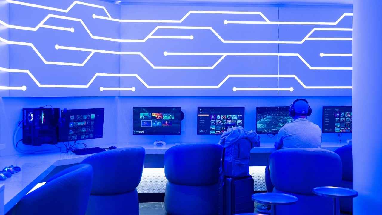 Gaming stations inside Portal Lounge let travelers play Nintendo Switch, Xbox, PlayStation and PC games before boarding.