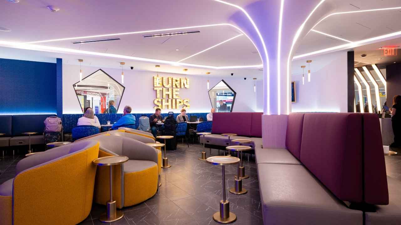 Inside Portal Lounge, travelers can relax in a tech-forward social space with seating, lighting, food, drinks and music.