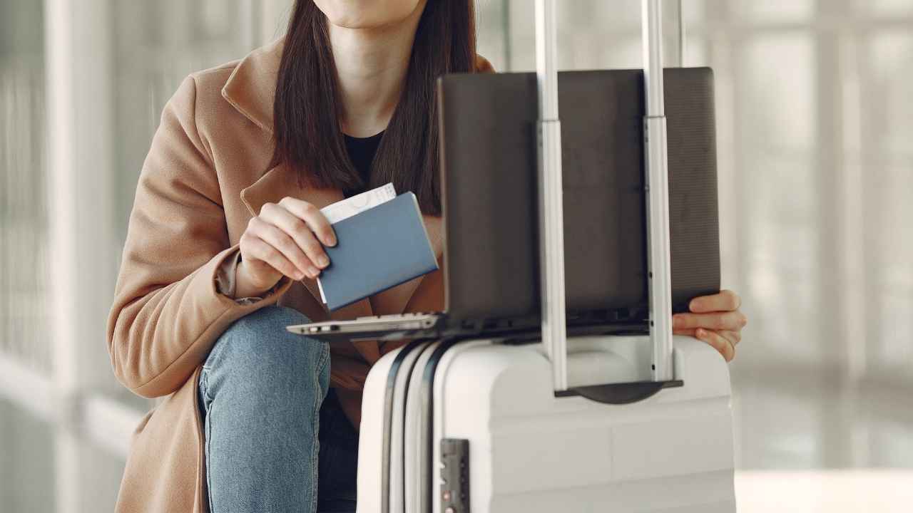 A traveler connects to hotel Wi-Fi, a common habit that can put personal accounts at risk when the network is not protected.