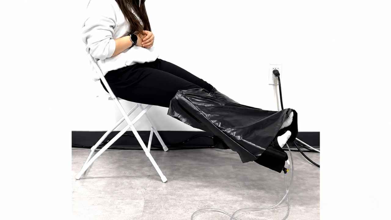 In this demonstration, the robotic garment unfurls over the legs while the wearer remains seated.